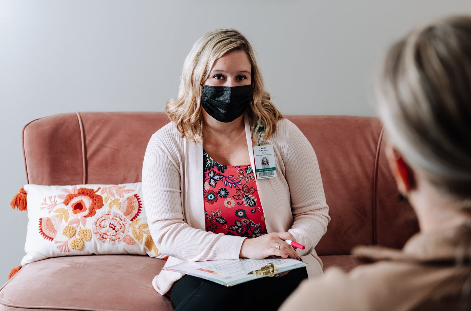 Caroline Braun, Clinical Programs Manager for Parkview Behavioral Health Institute, shows what a normal 1-1 therapy session would look like with a client during a mock session at Park Center, 2710 Lake Ave.