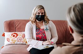 Caroline Braun, Clinical Programs Manager for Parkview Behavioral Health Institute, shows what a normal 1-1 therapy session would look like with a client during a mock session at Park Center, 2710 Lake Ave.