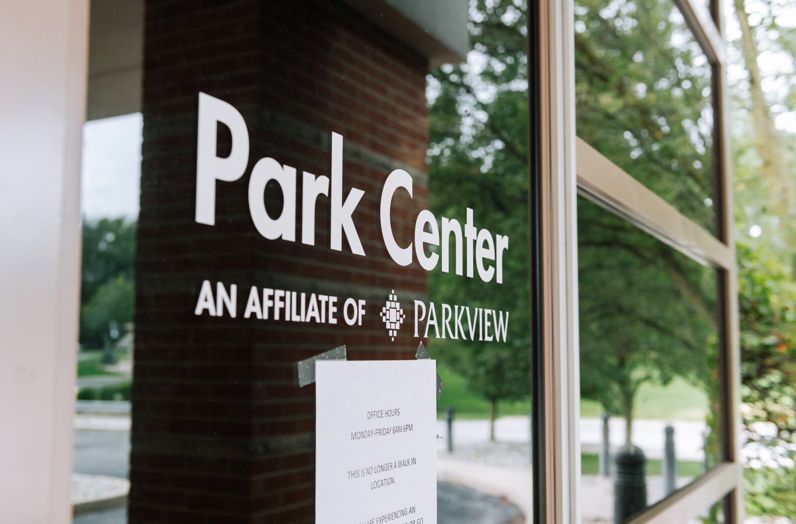 The sign on the front door at Park Center, 2710 Lake Ave.