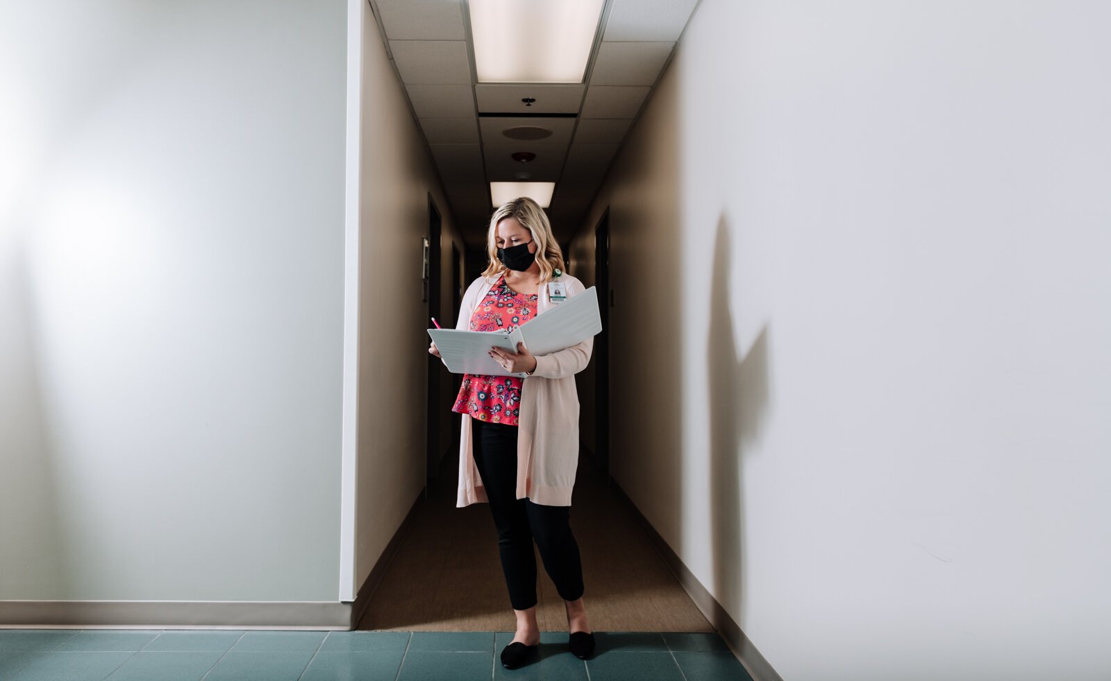 Caroline Braun, Clinical Programs Manager for Parkview Behavioral Health Institute, walks the halls at Park Center, 2710 Lake Ave.