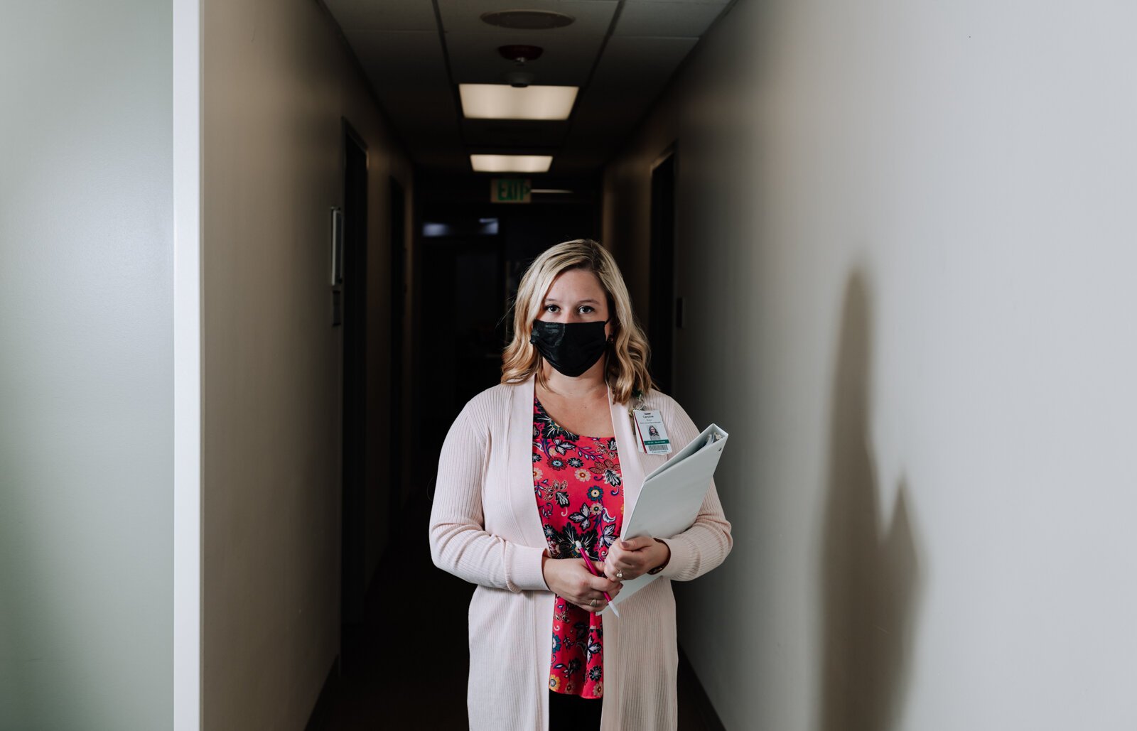 Caroline Braun, Clinical Programs Manager for Parkview Behavioral Health Institute, walks the halls at Park Center, 2710 Lake Ave.