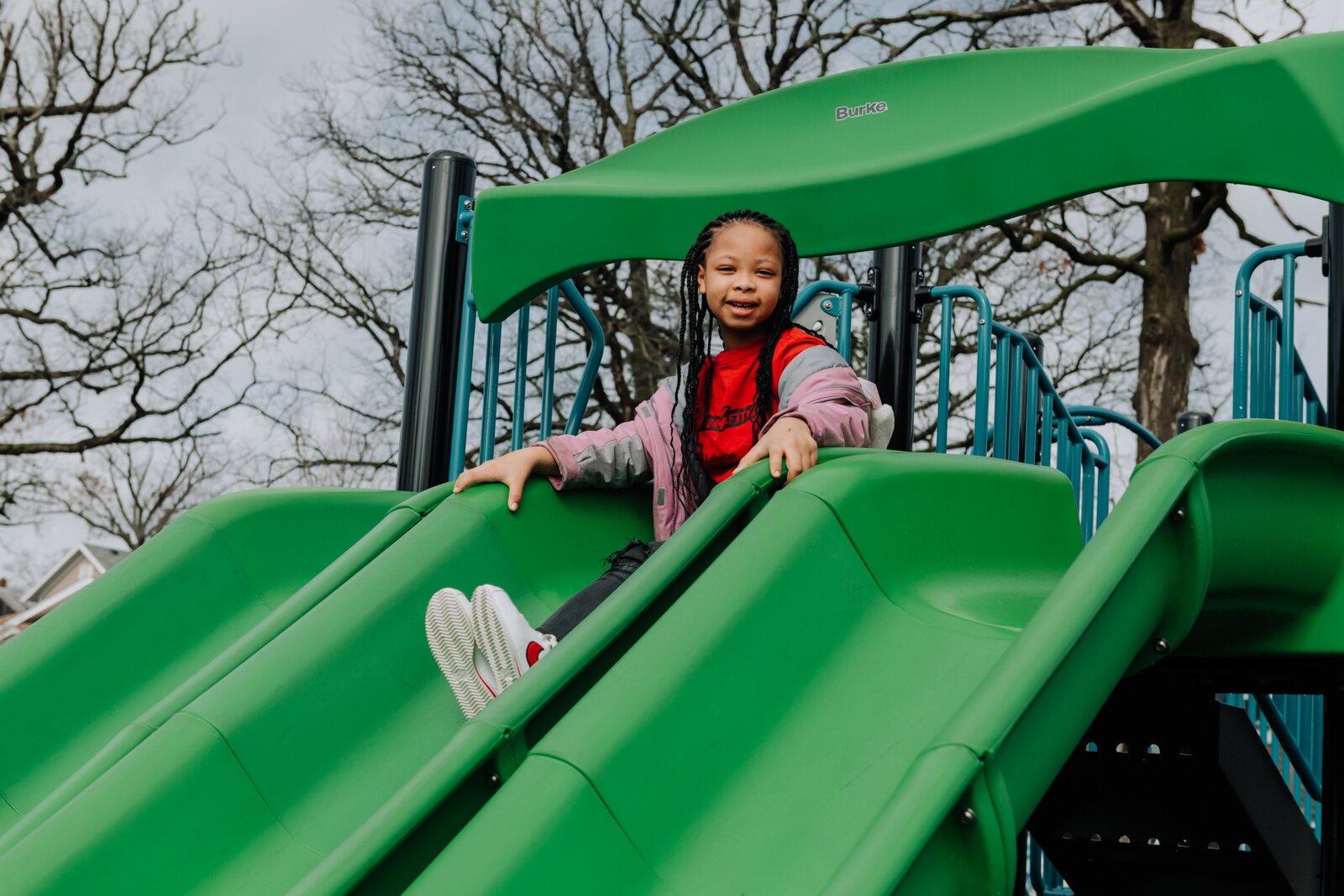 Kamyra Smith slides on the playground during the fourth grade recess at Forest Park Elementary School.