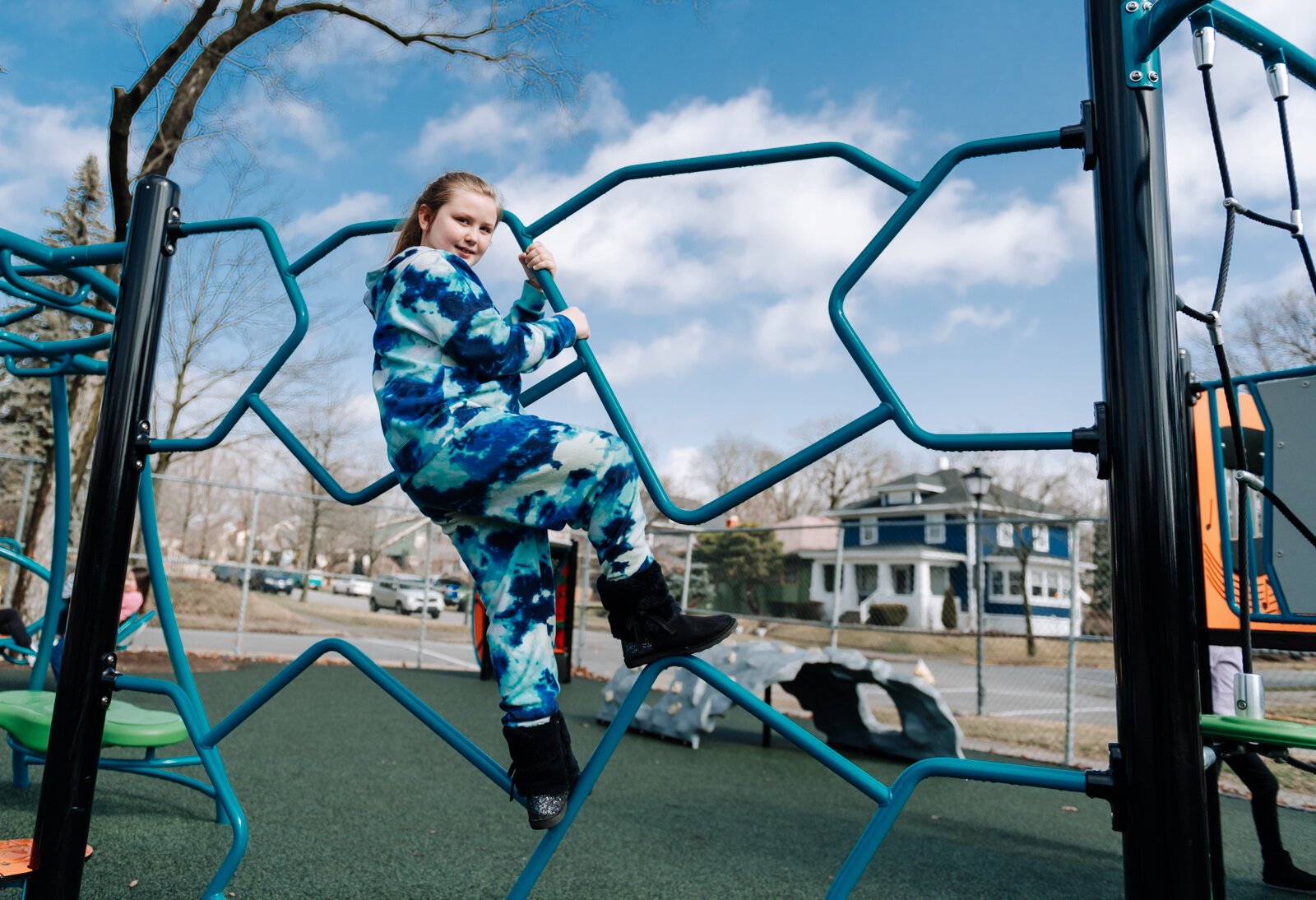 Karissa Kuntz enjoys climbing on the palyground during the fourth grade recess at Forest Park Elementary School.
