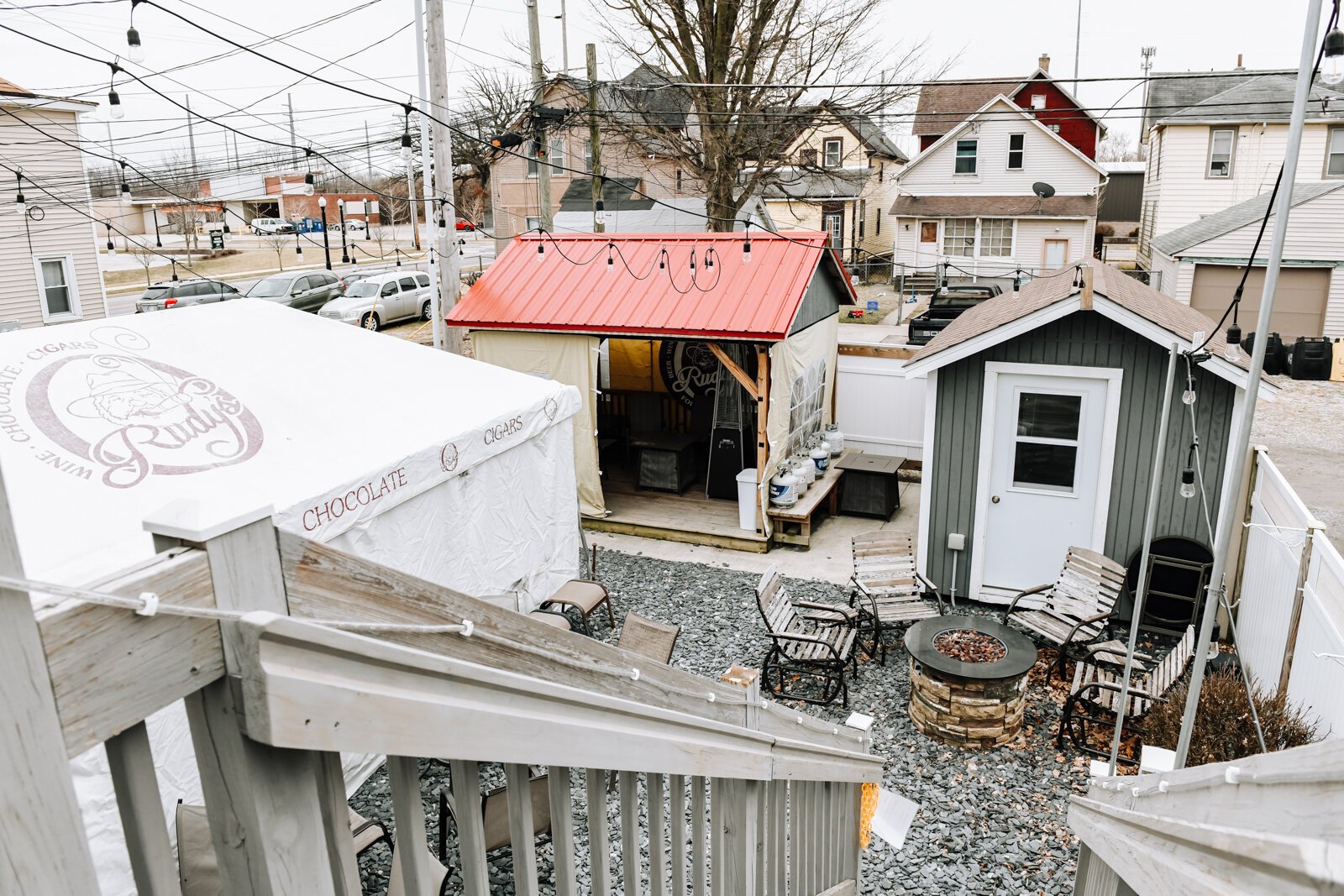 Outdoor seating located behind Rudy's Cigar Shop.