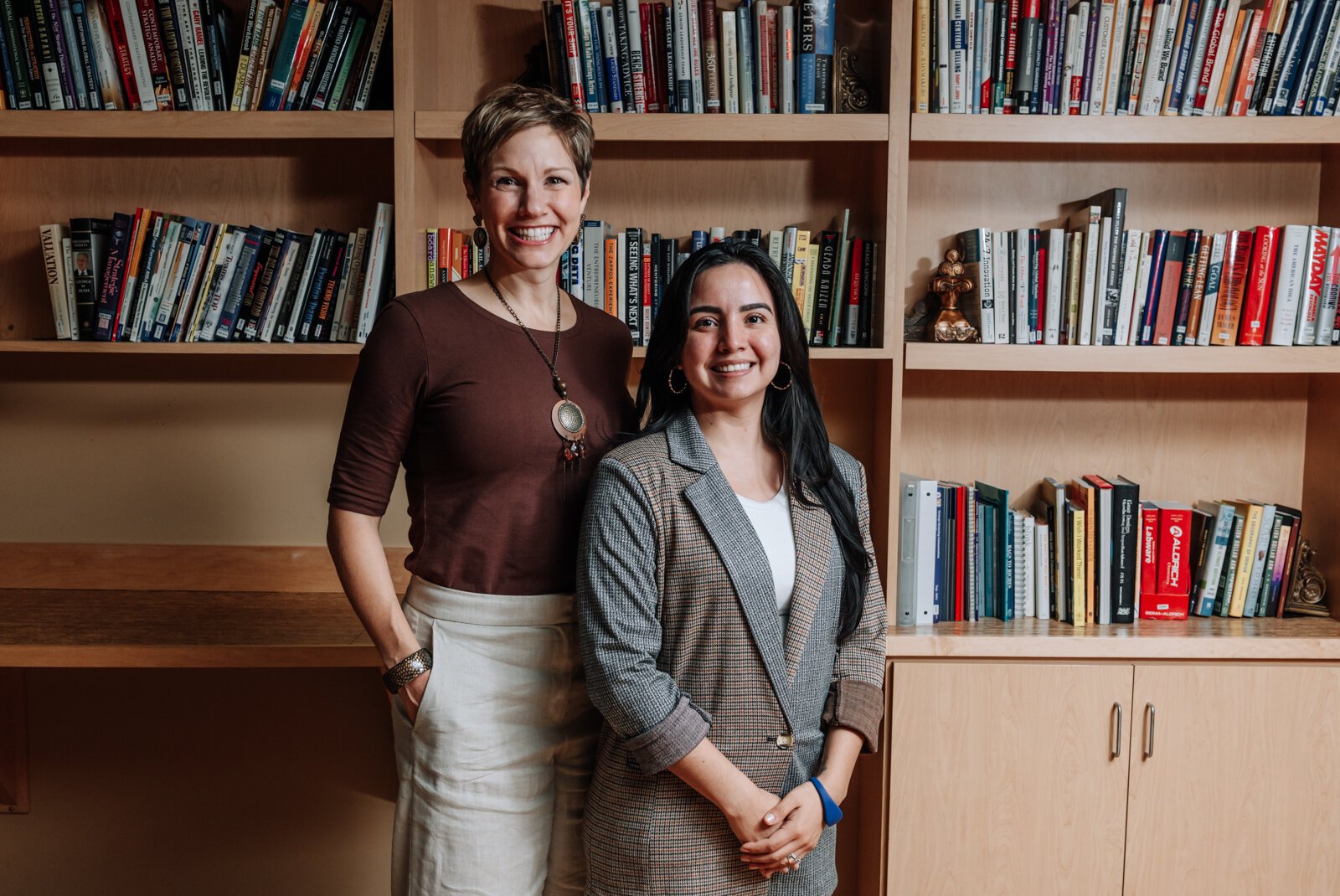 Portrait of Leslee Hill, left, Program Director and Rosalina Perez, Program Manager at WEOC Women's Business Center at the Northeast Indiana Innovation Center.