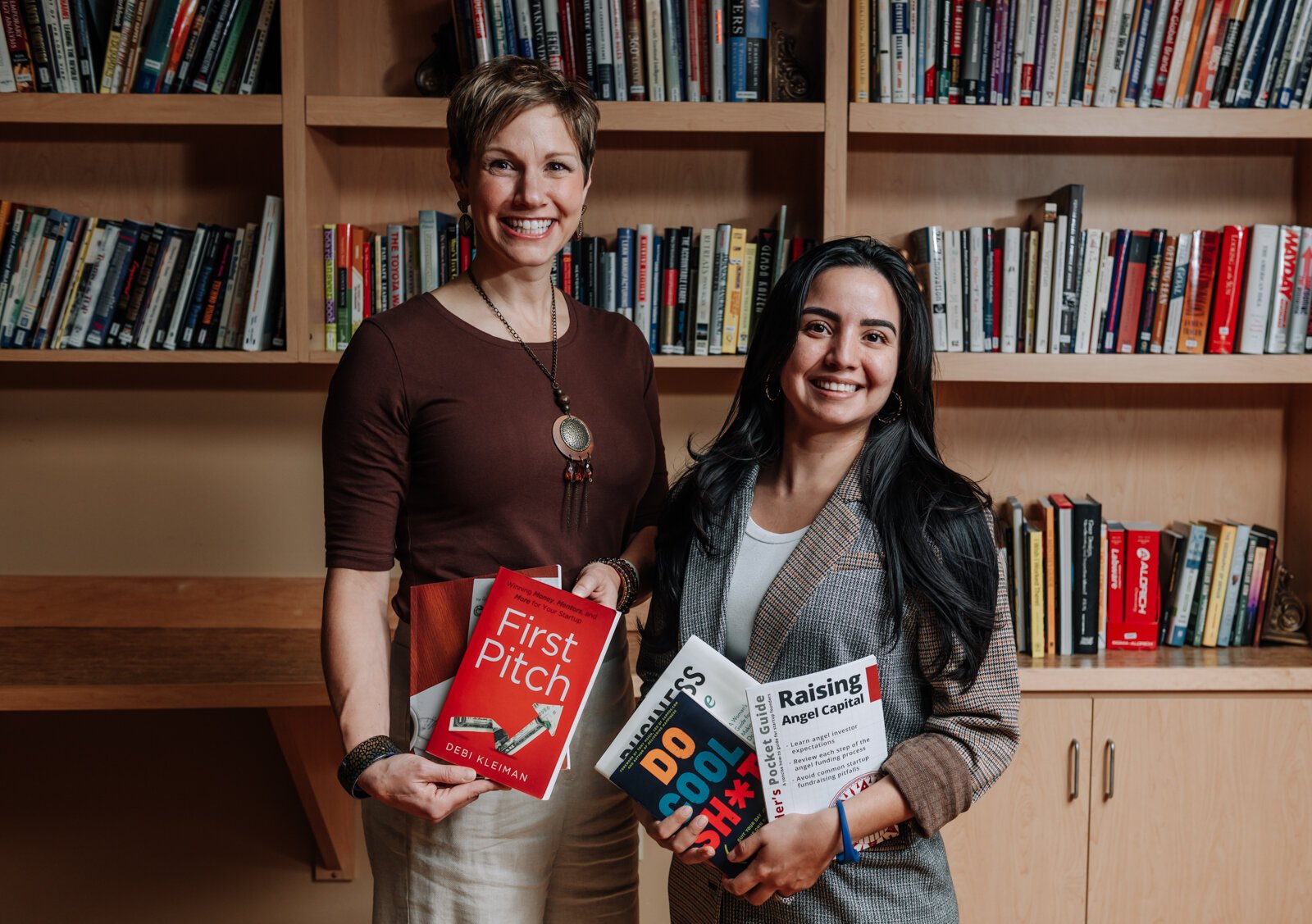 Portrait of Leslee Hill, left, Program Director and Rosalina Perez, Program Manager at WEOC Women's Business Center at the Northeast Indiana Innovation Center.