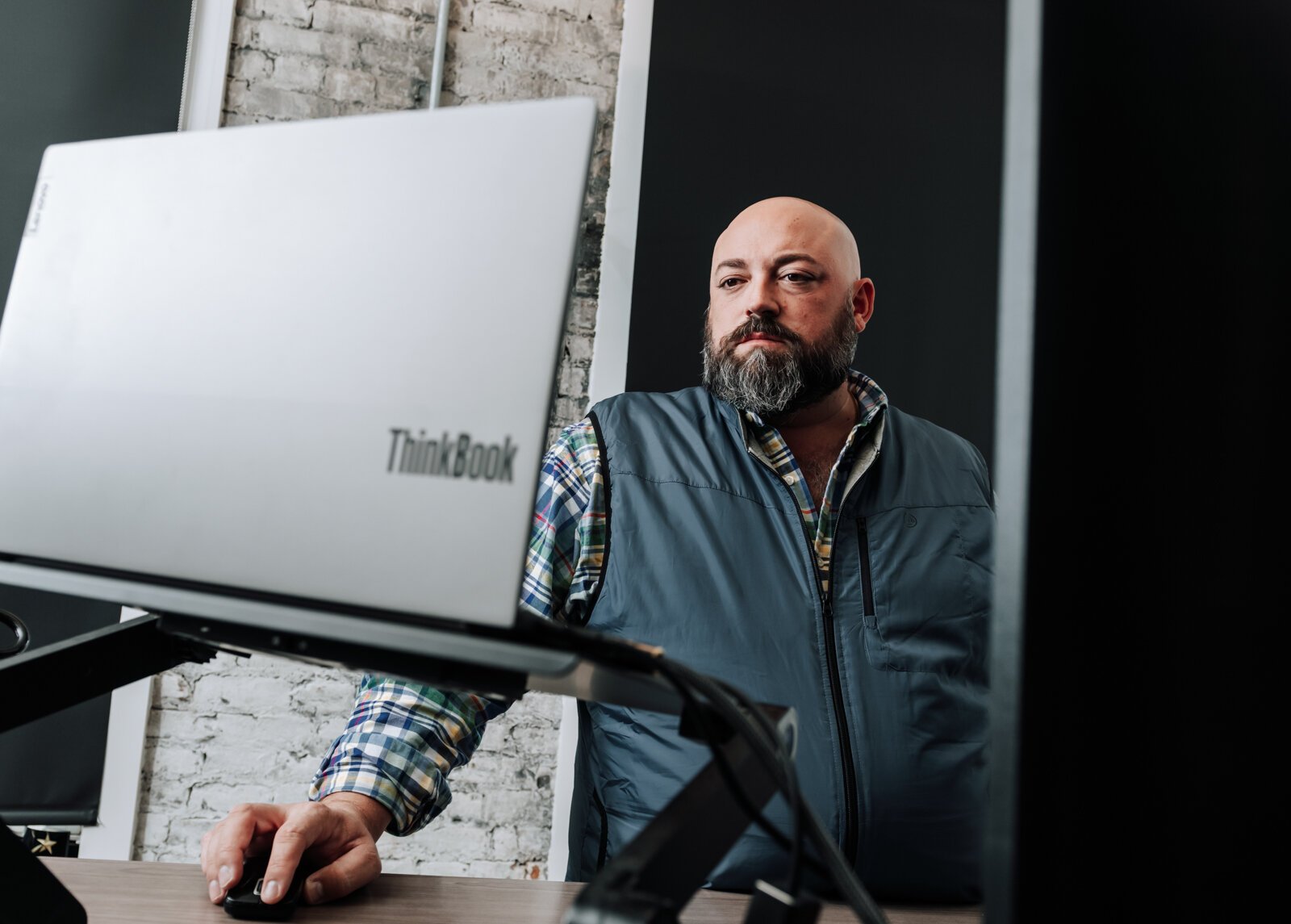 Shane Araujo, President/Co-Founder of 3BG SUPPLY CO. works in his office on The Landing in Fort Wayne, IN.