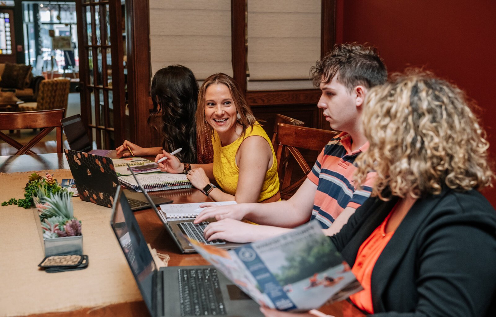 Christine Flohr, Executive Director at Visit Wabash County, has a meeting with staff members.