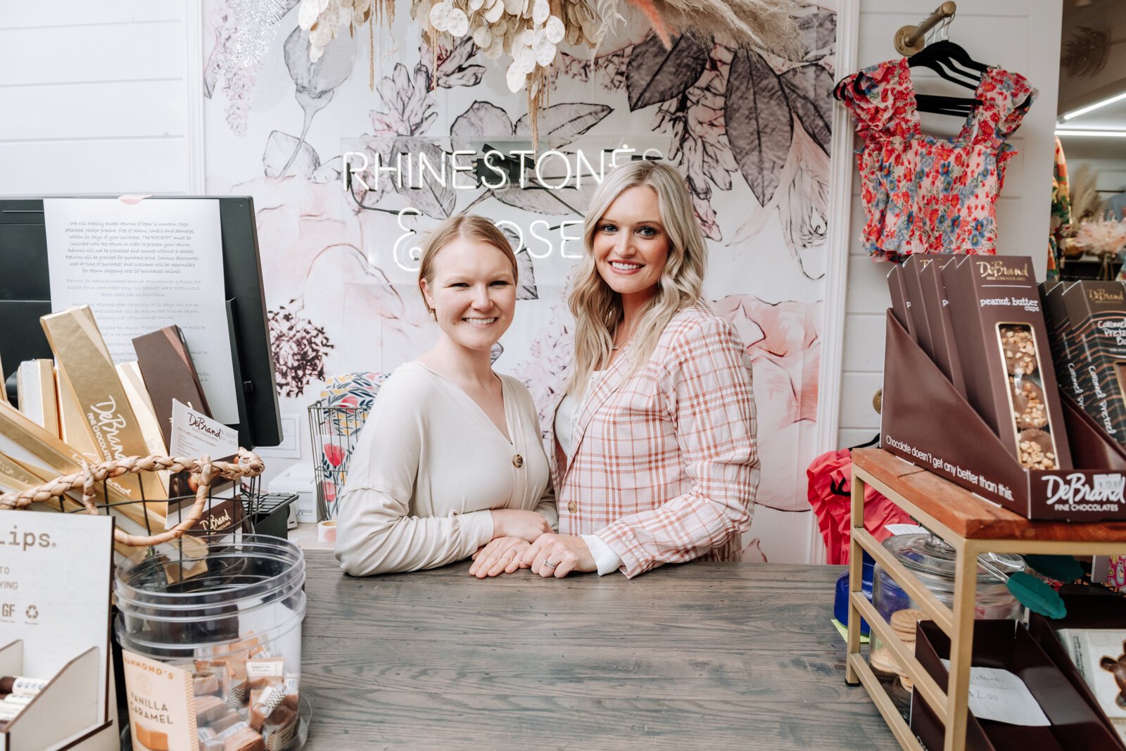 Portrait of owners Josi Cripe Lambert, left, and sister Jentri Cripe Lengerich at Rhinestones and Roses Flowers and Boutique, 302 W State Rd 114, North Manchester, IN.