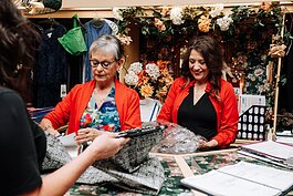 From right: Terri Francis-Alfed, owner, and Bobbi Palmer, assistant sales, help customer Kelly Thompson with a purchase at The Francis Shoppe.