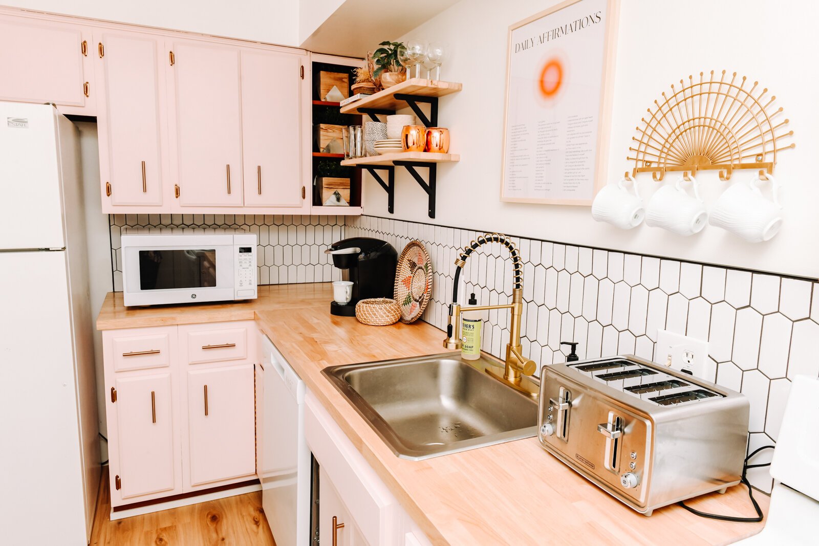 The kitchen has a pink theme.