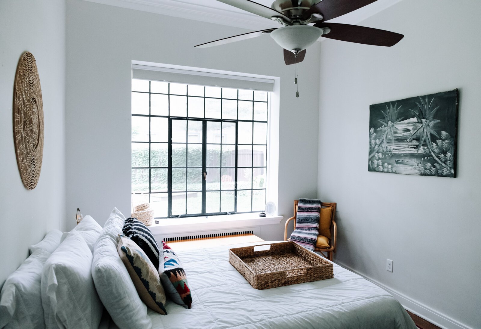 The bedroom features a lot of light as well as colors and textures to make the room pop in the apartment of Jamie Curtis on Edgewater Ave.
