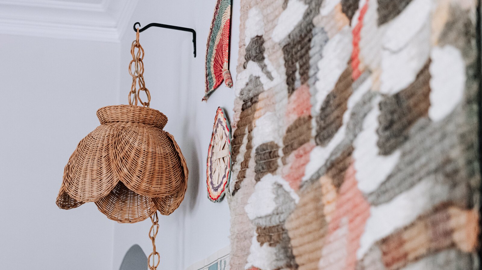 A light purchased from a thrift store in Florida is featured in the living room in the apartment of Jamie Curtis on Edgewater Ave. 