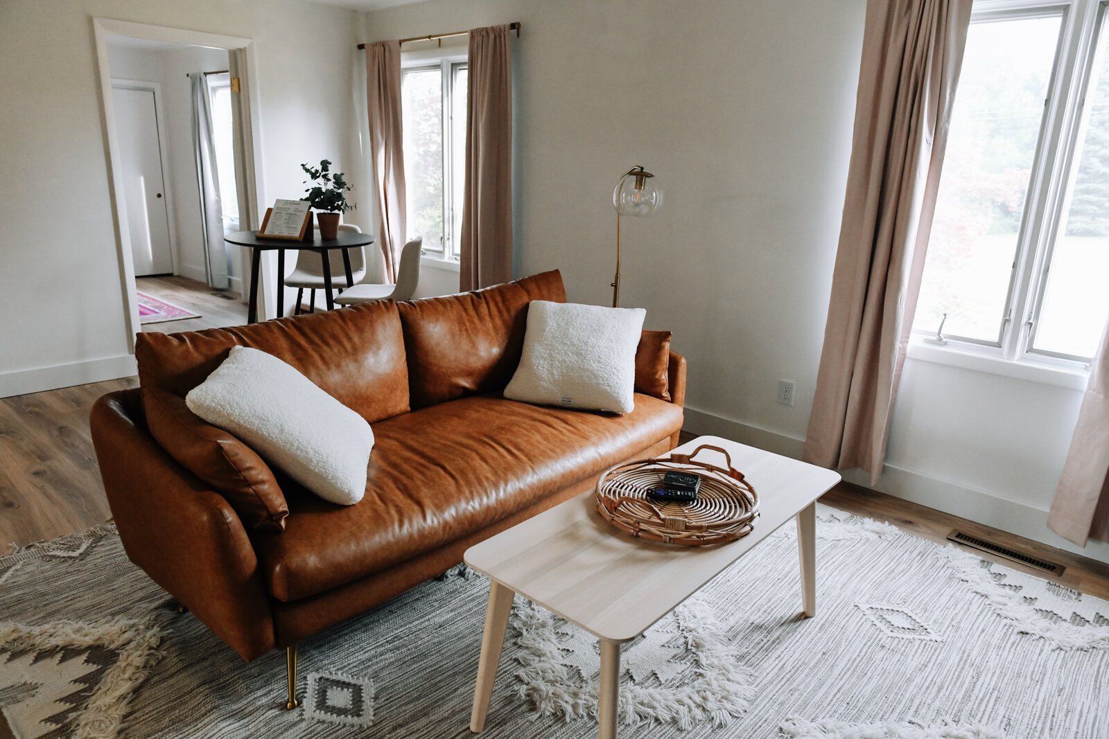 The living room features a cozy couch in the Airbnb owned by Olivia Nelson in Fort Wayne.