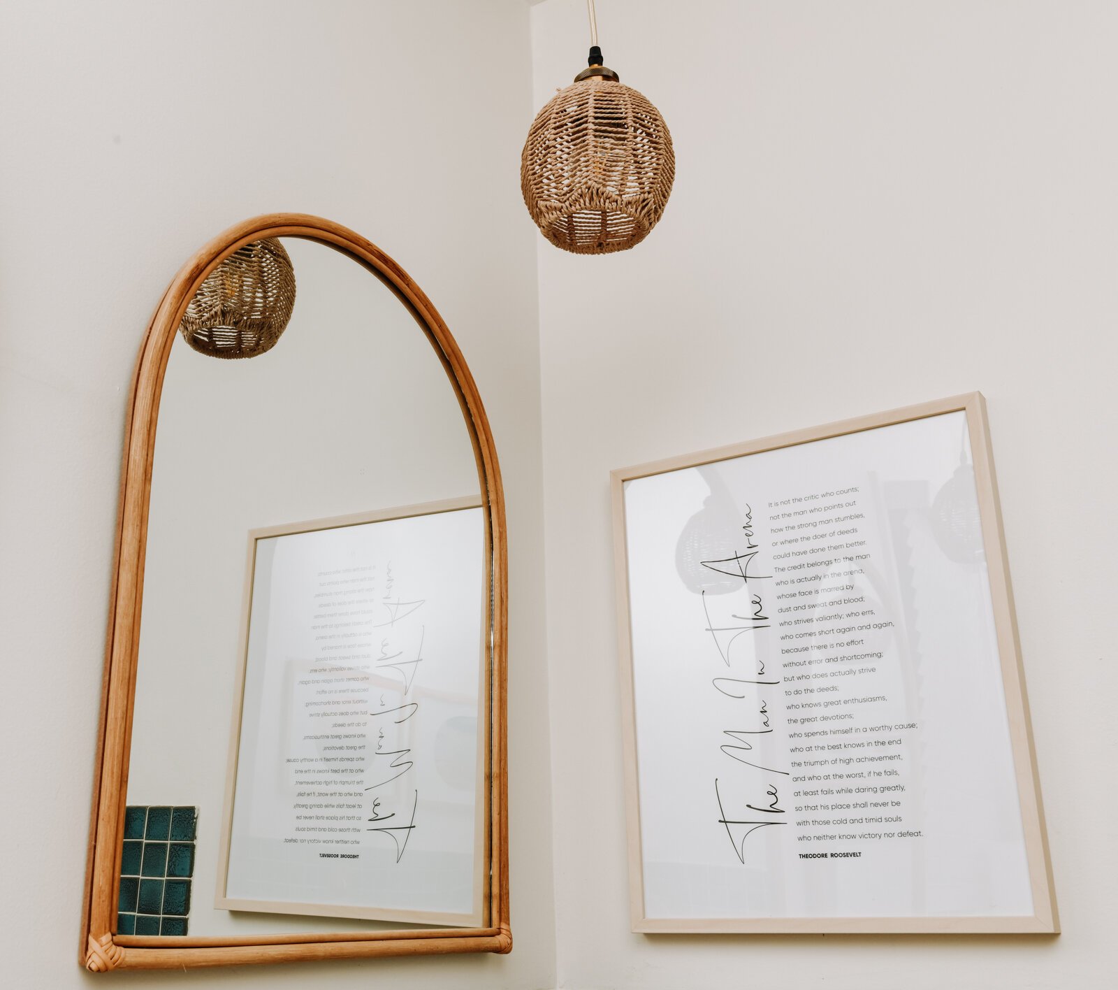 The main bathroom features gold and green tones, mirrors and original tile.