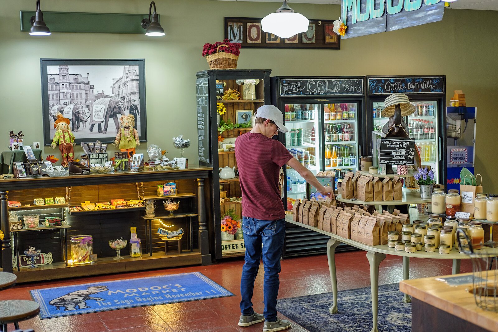 Jacob Marlow stocks coffee at Modoc's Market in Downtown Wabash.