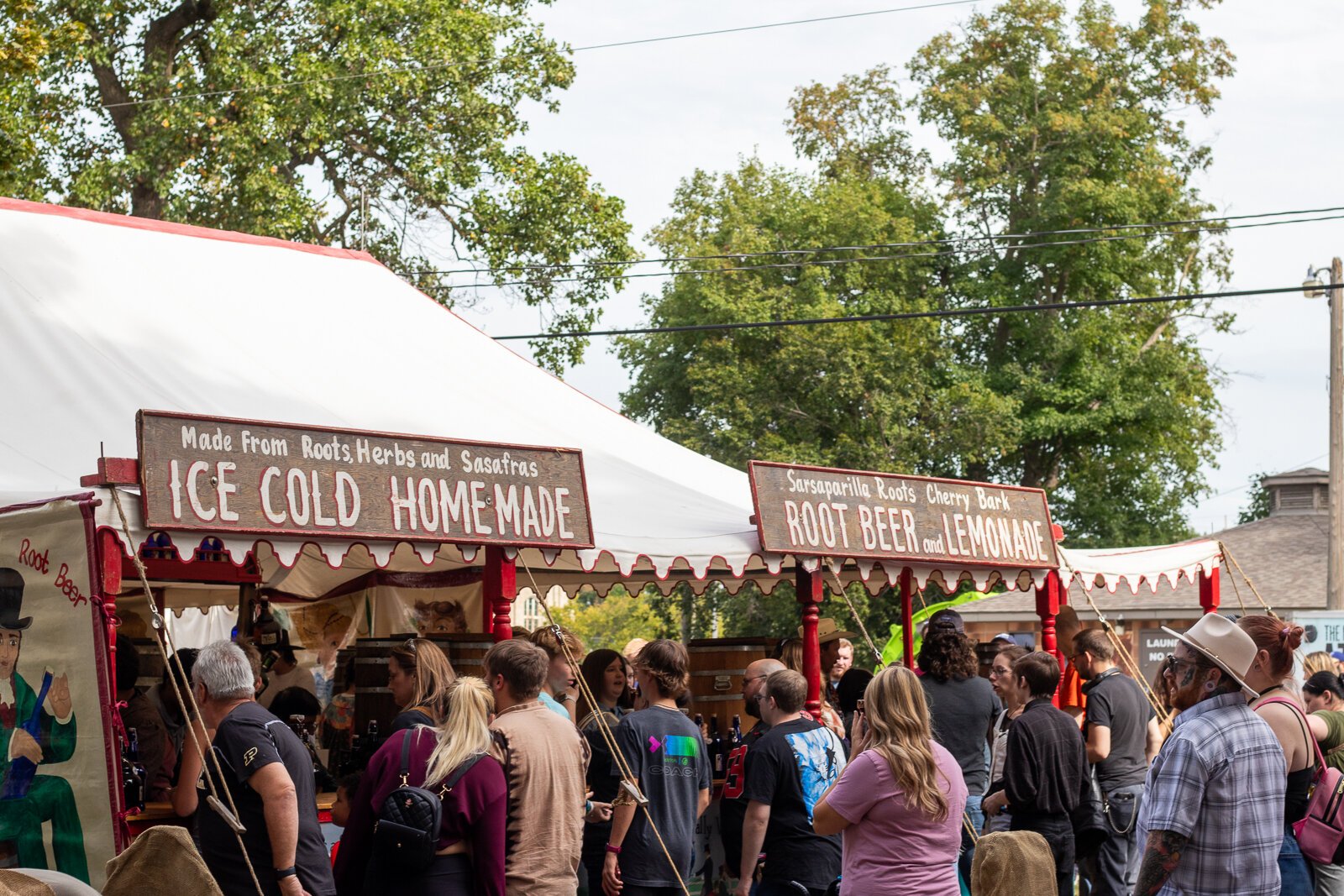 Festival-goers wait in line for Little Johns Sarsaparilla Rootbeer, a staple of the Johnny Appleseed Festival.