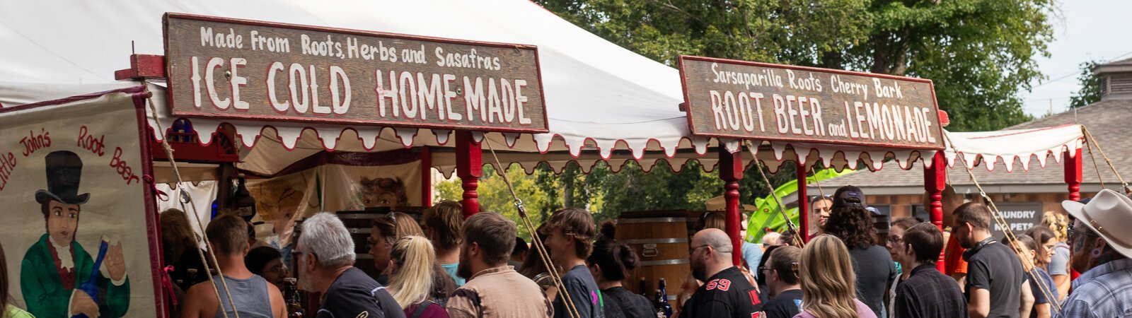 Festival-goers wait in line for Little John's Sarsaparilla Rootbeer, a staple of the Johnny Appleseed Festival.