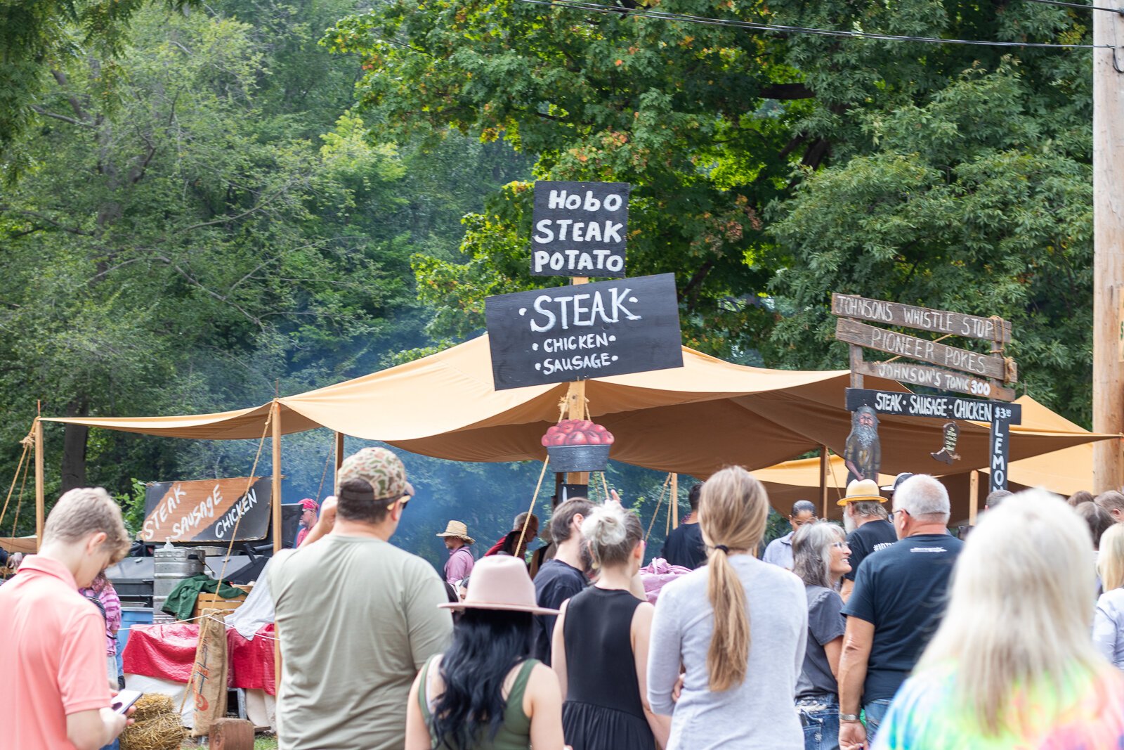 Festival-goers find their way through the crowded walkway.