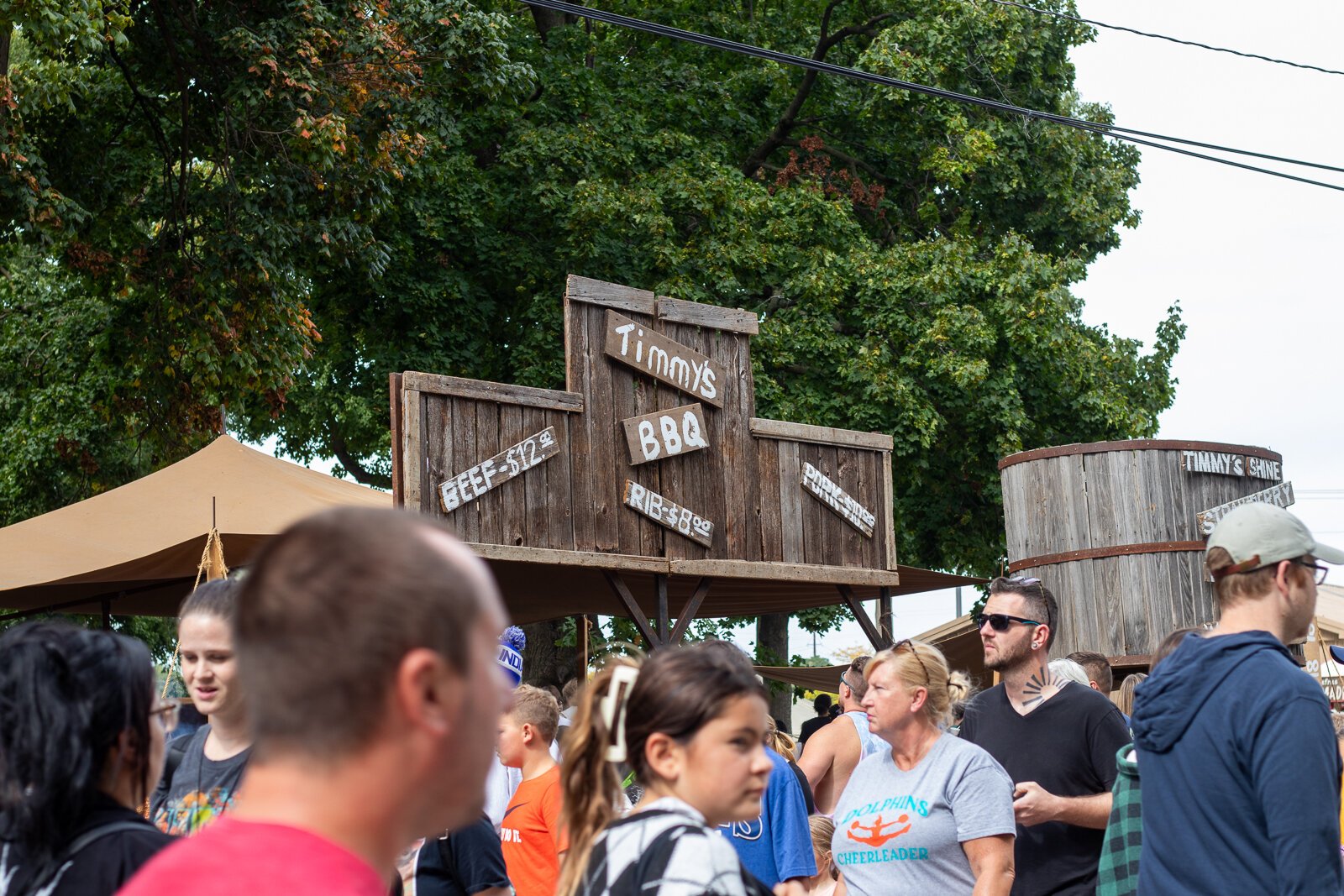 Festival-goers find their way through the crowded walkway.