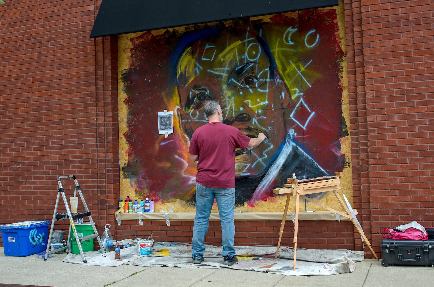 Jeff Pilkinton paints a mural of Mt. Luther King Jr. in downtown Fort Wayne.
