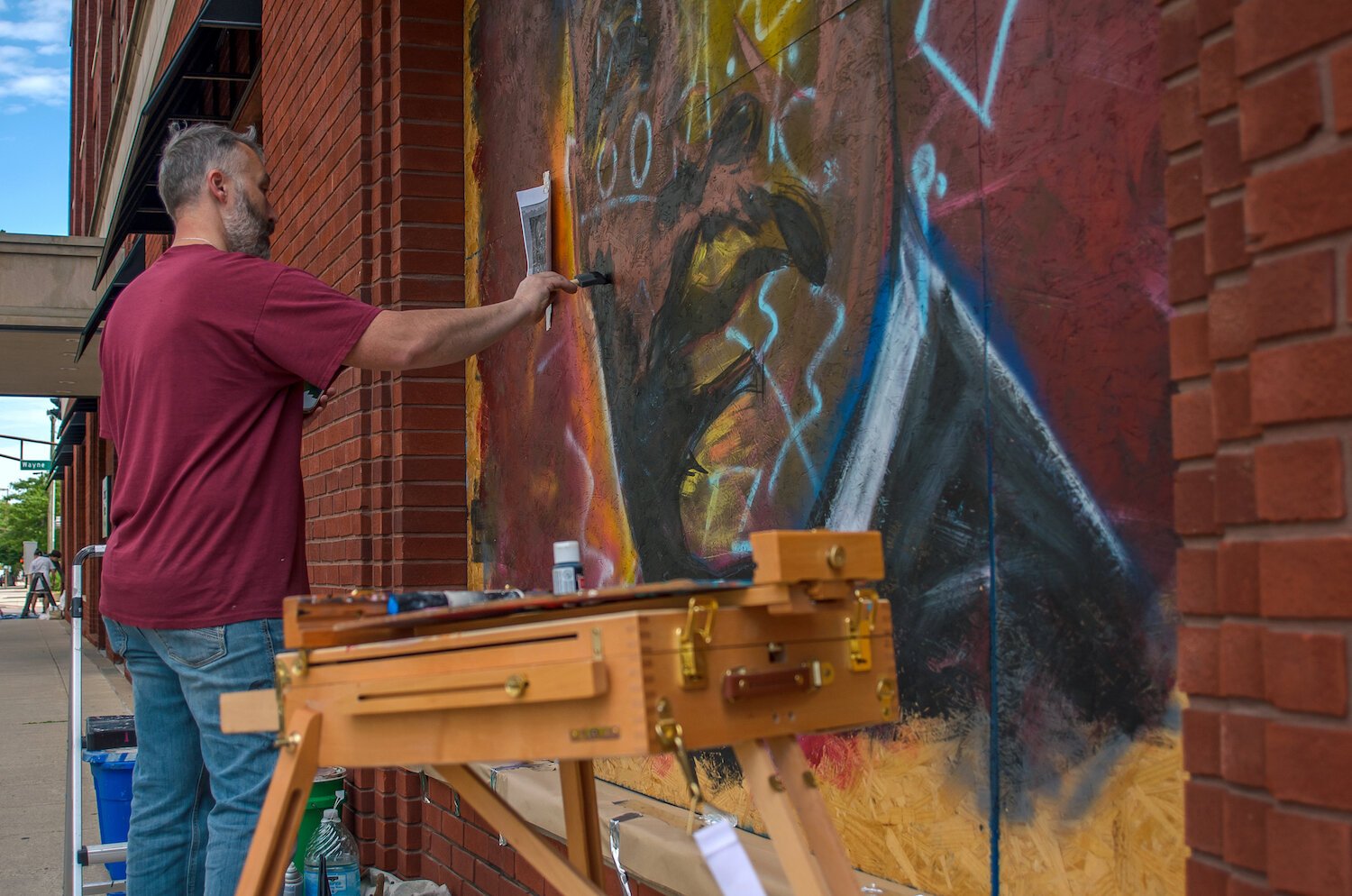 Jeff Pilkinton paints a mural of Mt. Luther King Jr. in downtown Fort Wayne.