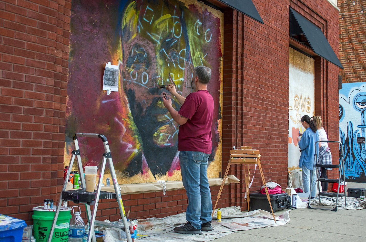 Jeff Pilkinton paints a mural of Mt. Luther King Jr. in downtown Fort Wayne.