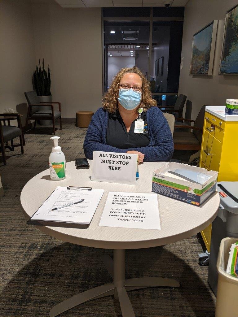  Jen Todd, an Information Services project leader for Parkview Health, is pictured at a visitor check-in area at Parkview Regional Medical Center as part of the Helping Hands program.