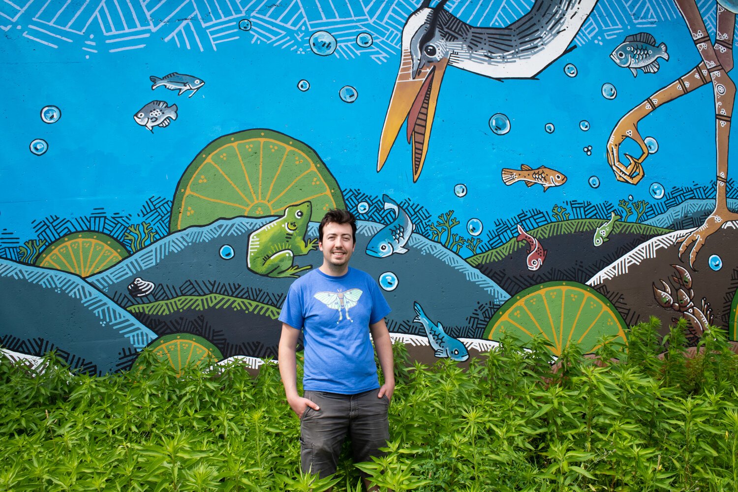 Jeremy Stroup painted an Art This Way mural of his own called “Blue Diver” in 2020 on a railroad underpass at Grand and Calhoun Streets.