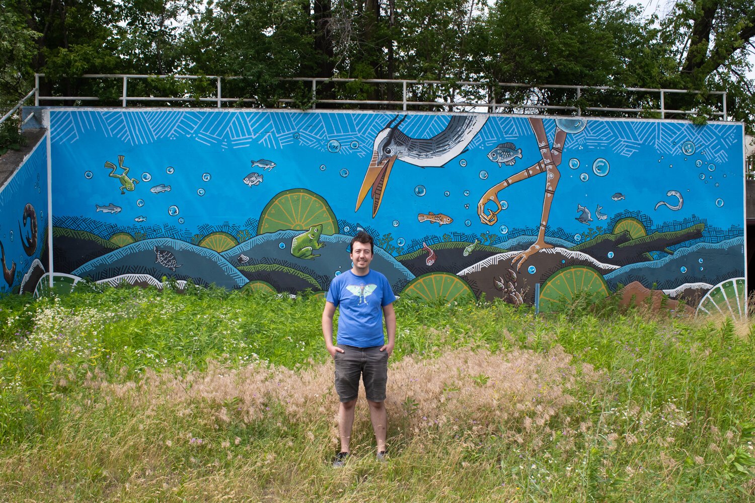 Jeremy Stroup painted an Art This Way mural of his own called “Blue Diver” in 2020 on a railroad underpass at Grand and Calhoun Streets.