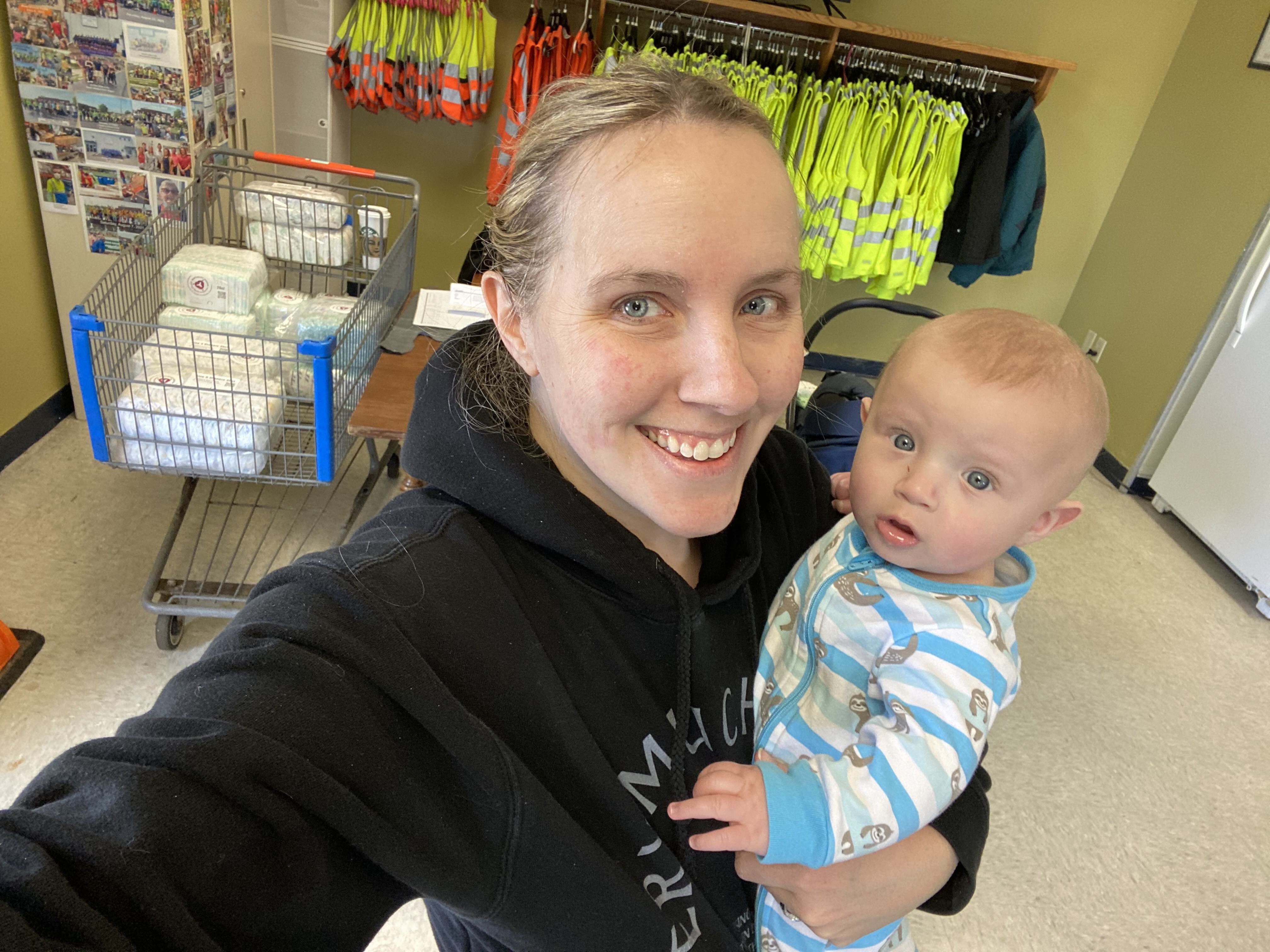 Jennifer Norris-Hale, founder of Mission: Motherhood, works a diaper drive event with her youngest son.