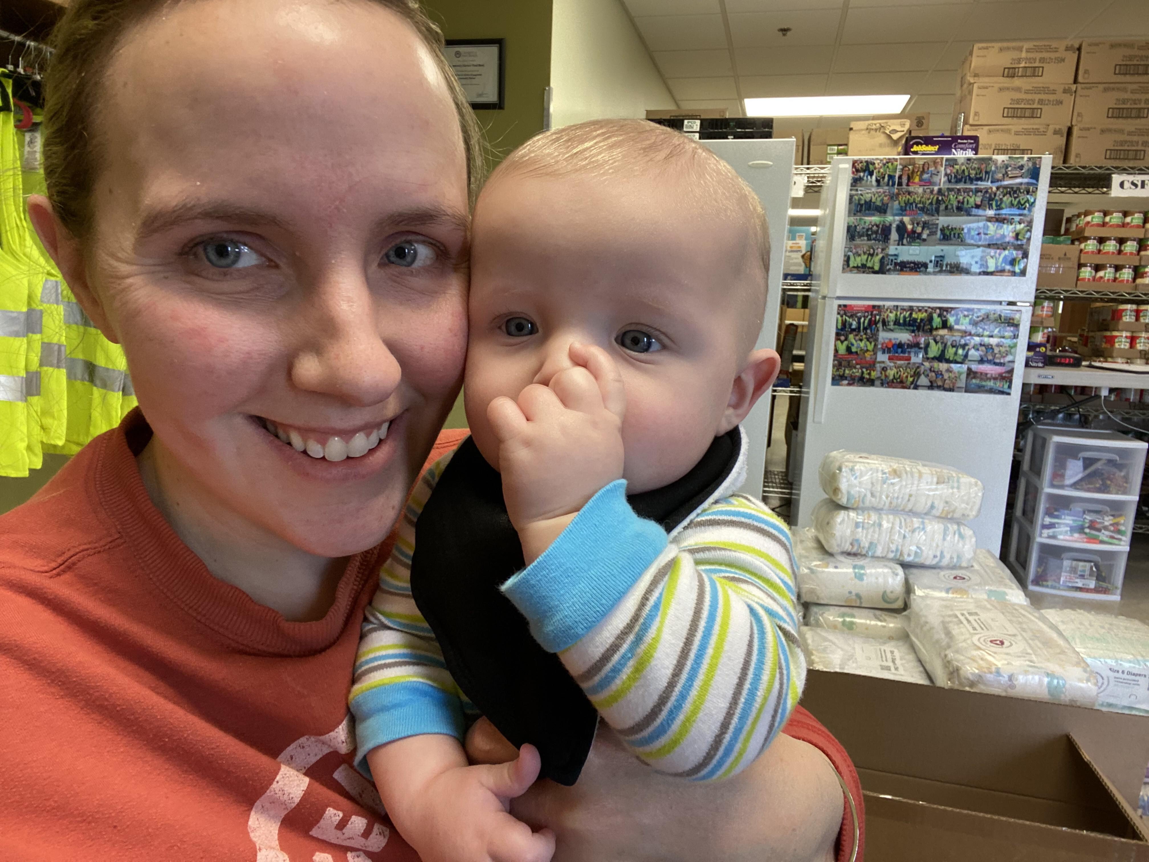 Jennifer Norris-Hale, founder of Mission: Motherhood, works a diaper drive event with her youngest son.