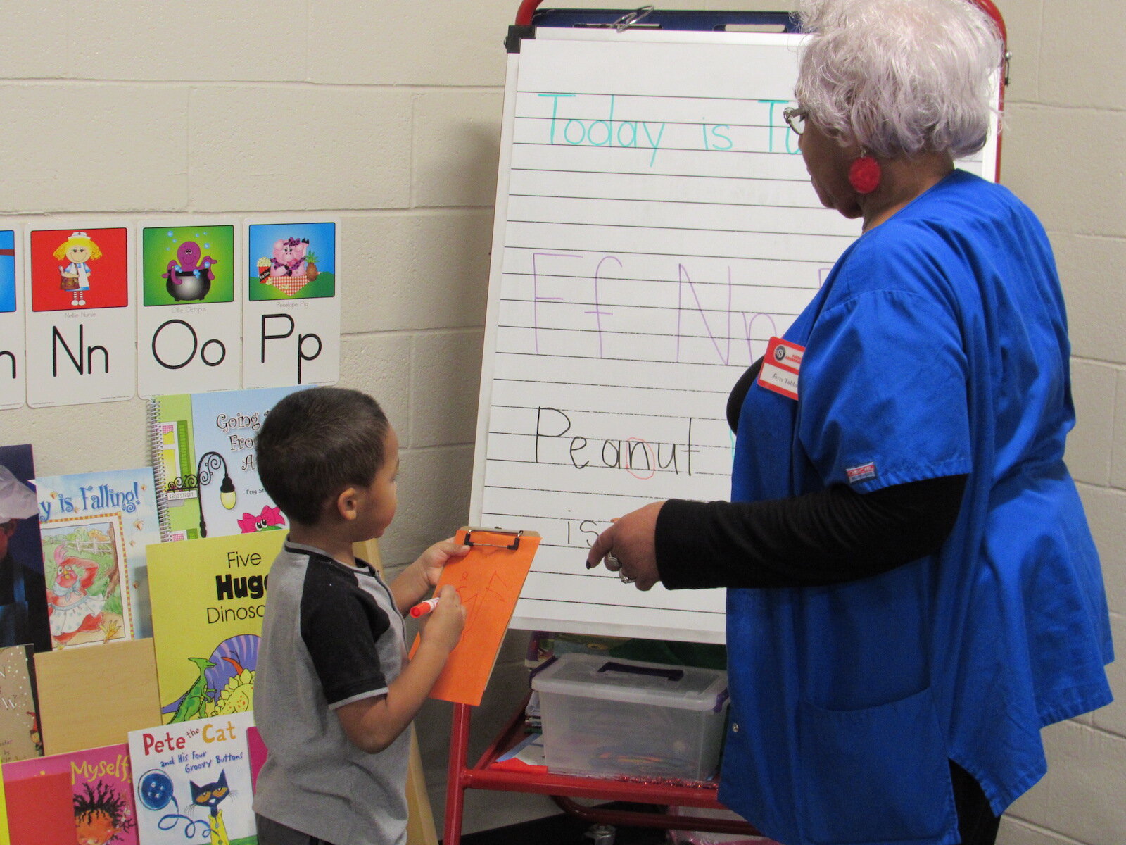 Joyce, a foster grandparent, works with preschoolers in their classroom.