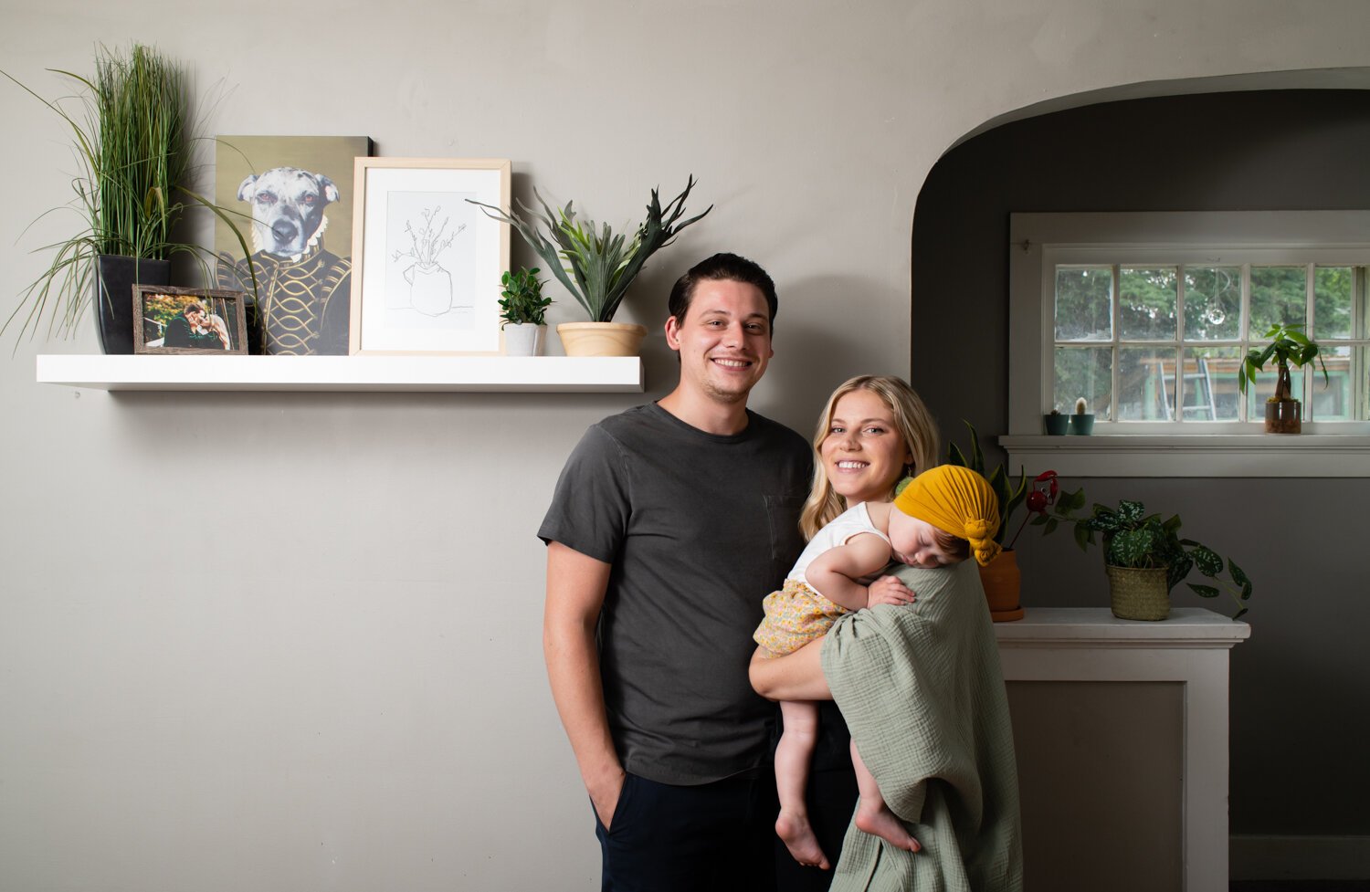 Katie Fyfe and her fiancé, Andy Gelwicks, with their 8-month-old daughter, Poppy, in their living room. 