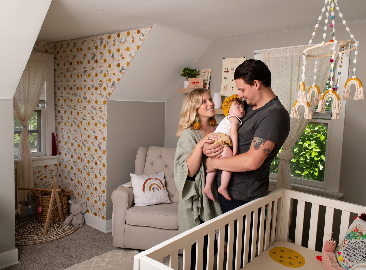 Katie Fyfe and her fiancé, Andy Gelwicks, with their 8-month-old daughter, Poppy, in Poppy’s room.  