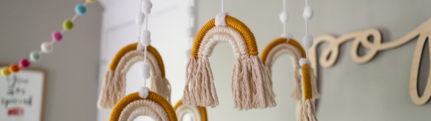 Katie Fyfe and Andy Gelwicks give us a tour of their baby-friendly bohemian bungalow. This rainbow mobile from Etsy is in their 8-month-old daughter Poppy's room. 