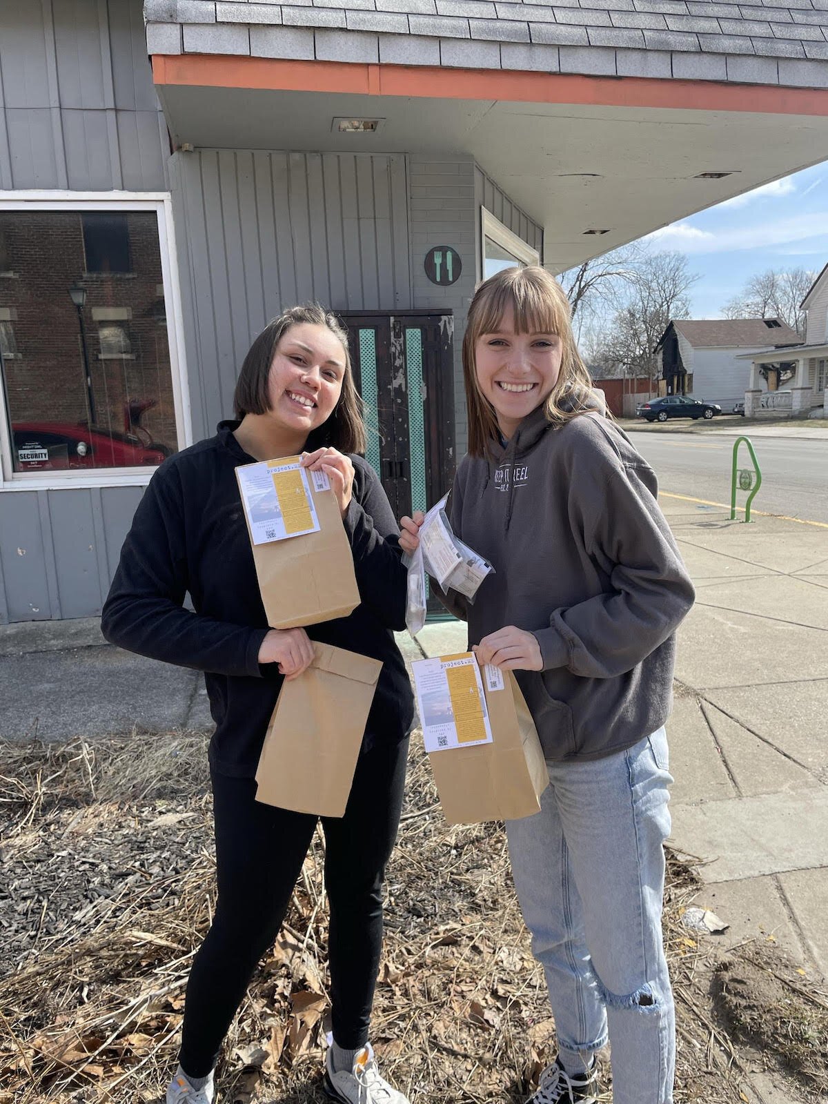 Kara and Kiersa drop off safe-use kits and a variety of other materials from project.ME to local pantries.