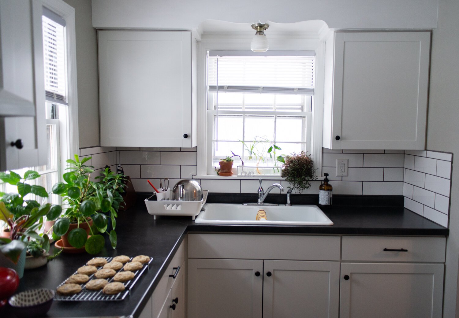 The kitchen is filled with natural light at the home of Katie Jo and Tobi Newson.