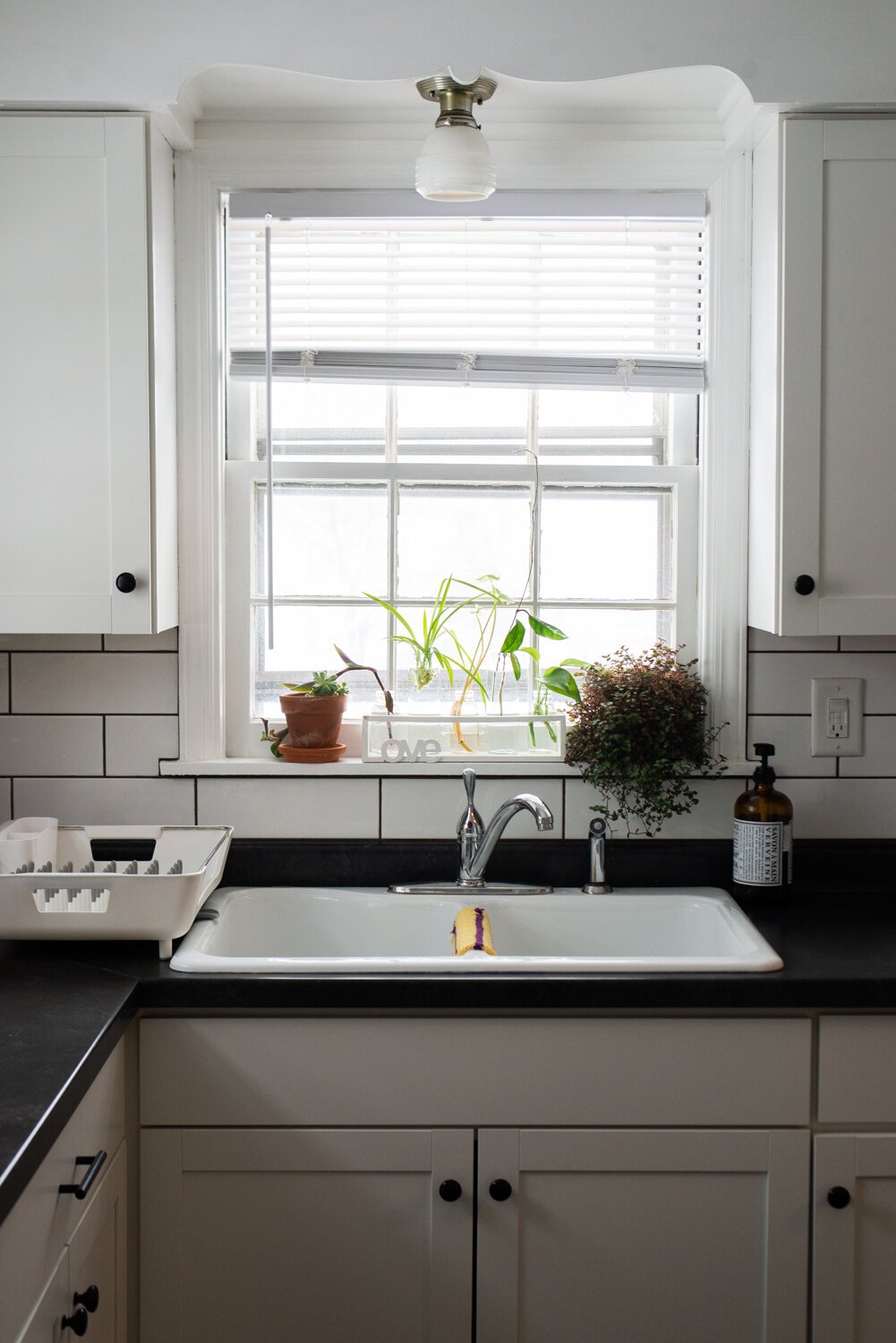 The kitchen is filled with natural light at the home of Katie Jo and Tobi Newson.