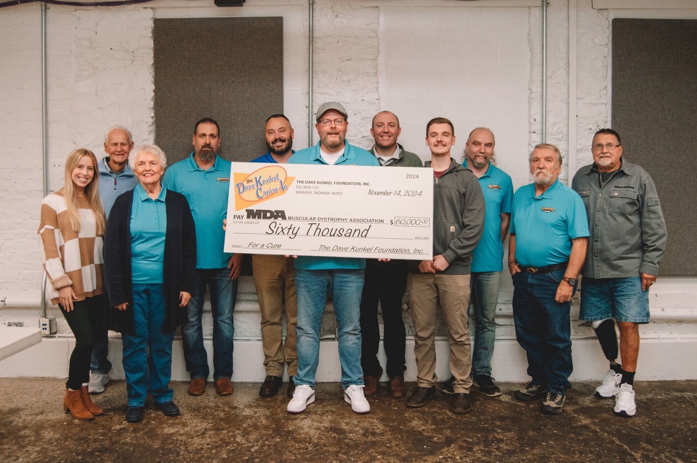 Members of the Kunkel Foundation with a check to Muscular Dystrophy Association