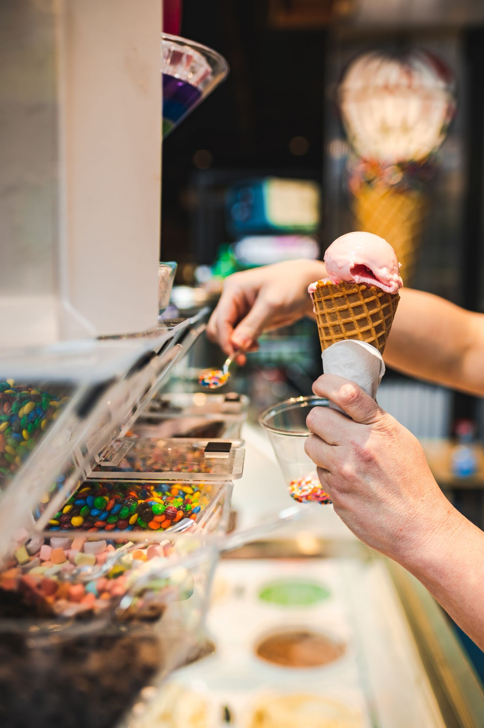 Local Apple Cart Owner Rachel Nally makes an ice cream cone.