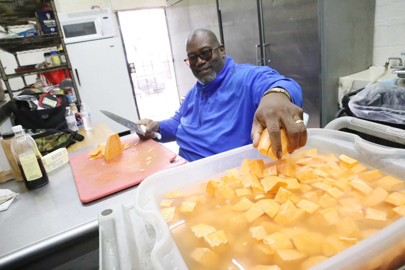 Curry works in his kitchen at Neighborhood Smokehouse.