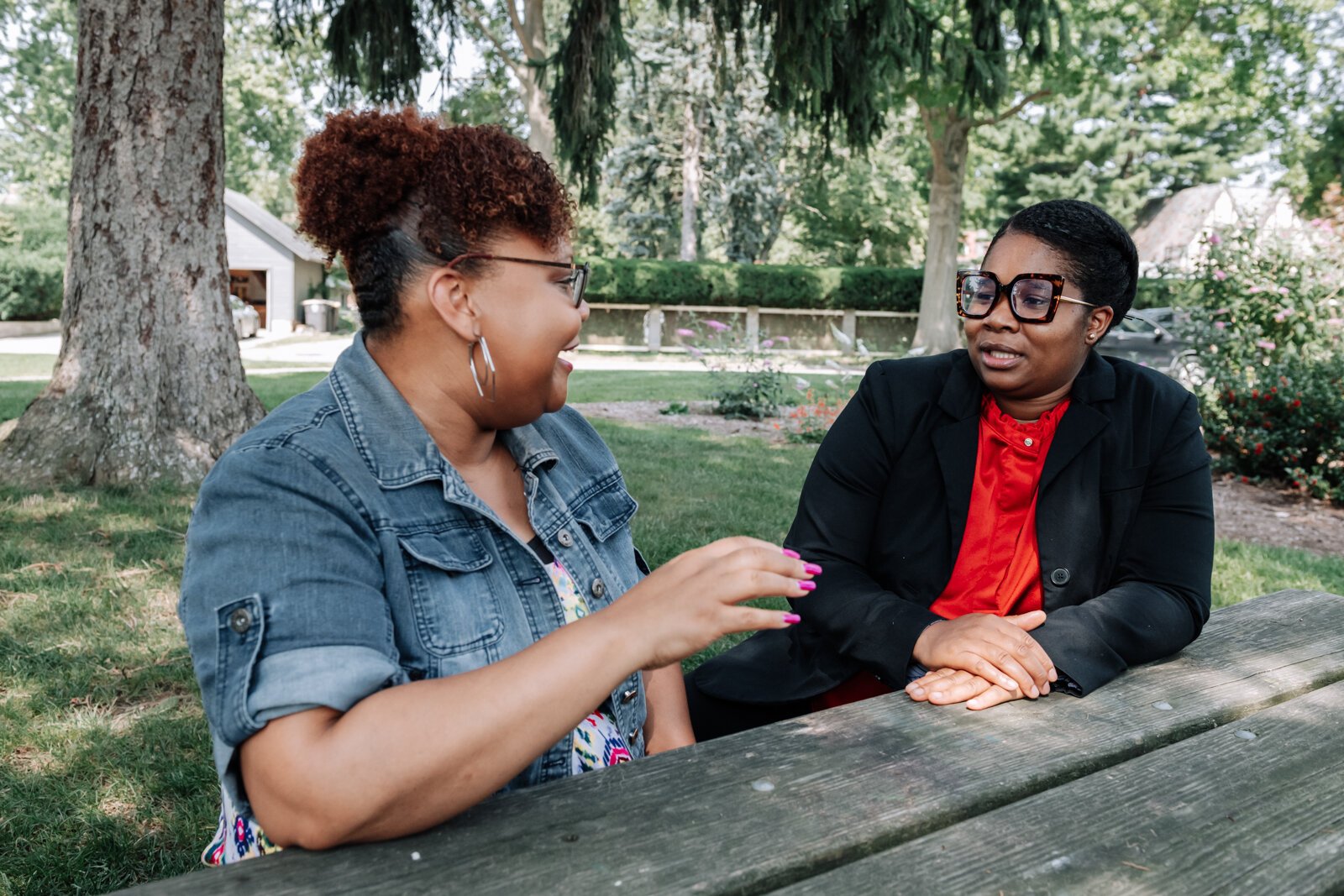 LaQueisha Brown, right, and Myla Rogers, left, catch up with one another at Lakeside Park.