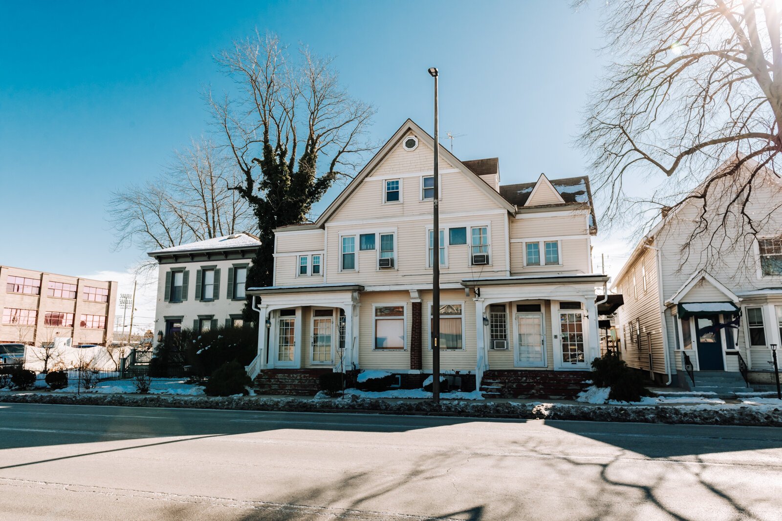 Exterior photos of the Sion Bass House, left, and the Thomas Snook House, right, of LaSalle Guest Houses.