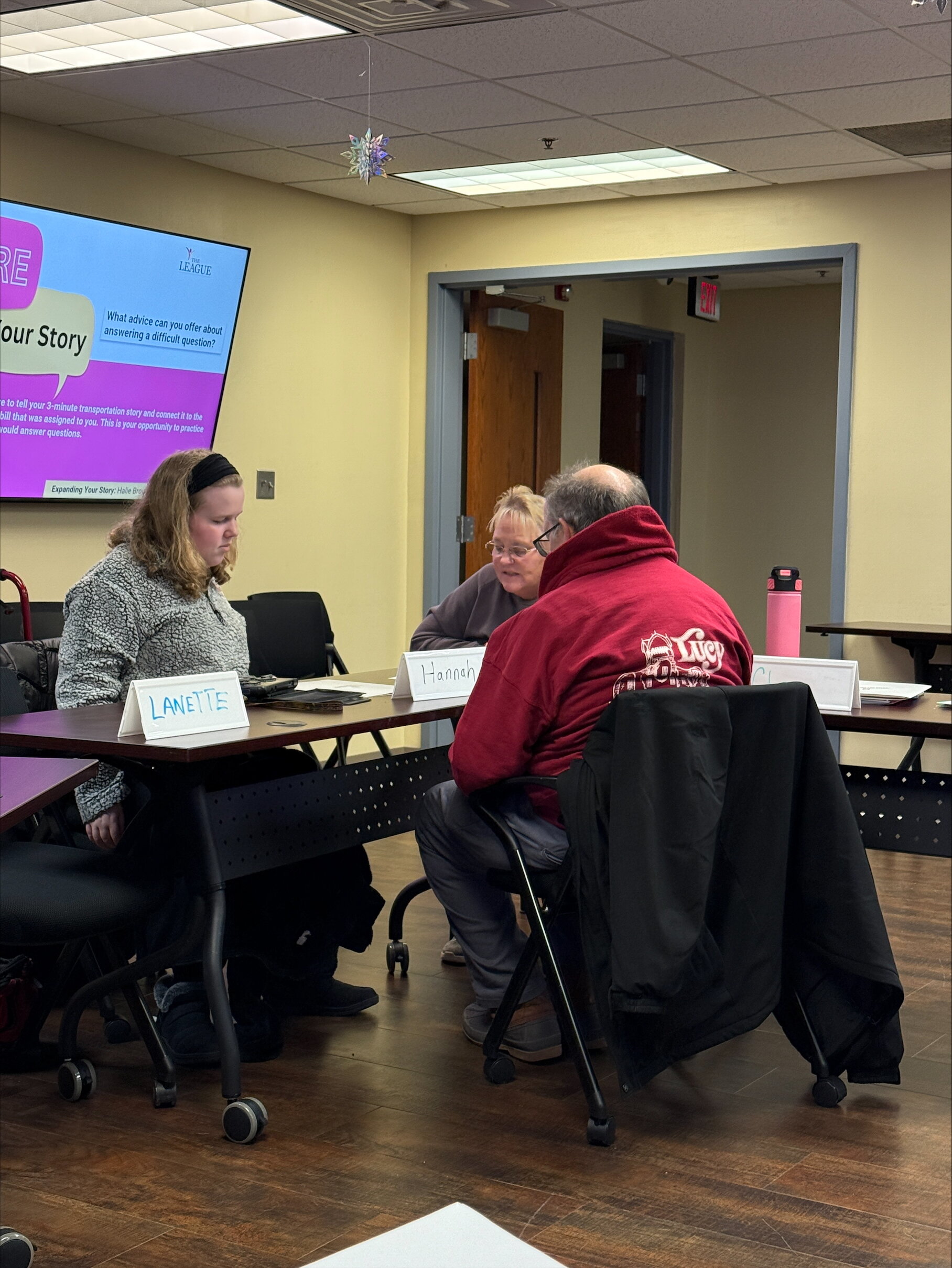 Participants work in small groups on team building exercises.