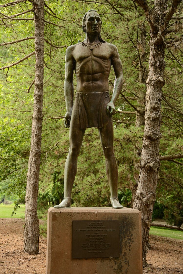 A statue of Cheif Little Turtle by Hector Garcia (1976) in Fort Wayne's Headwaters Park East near the footbridge.