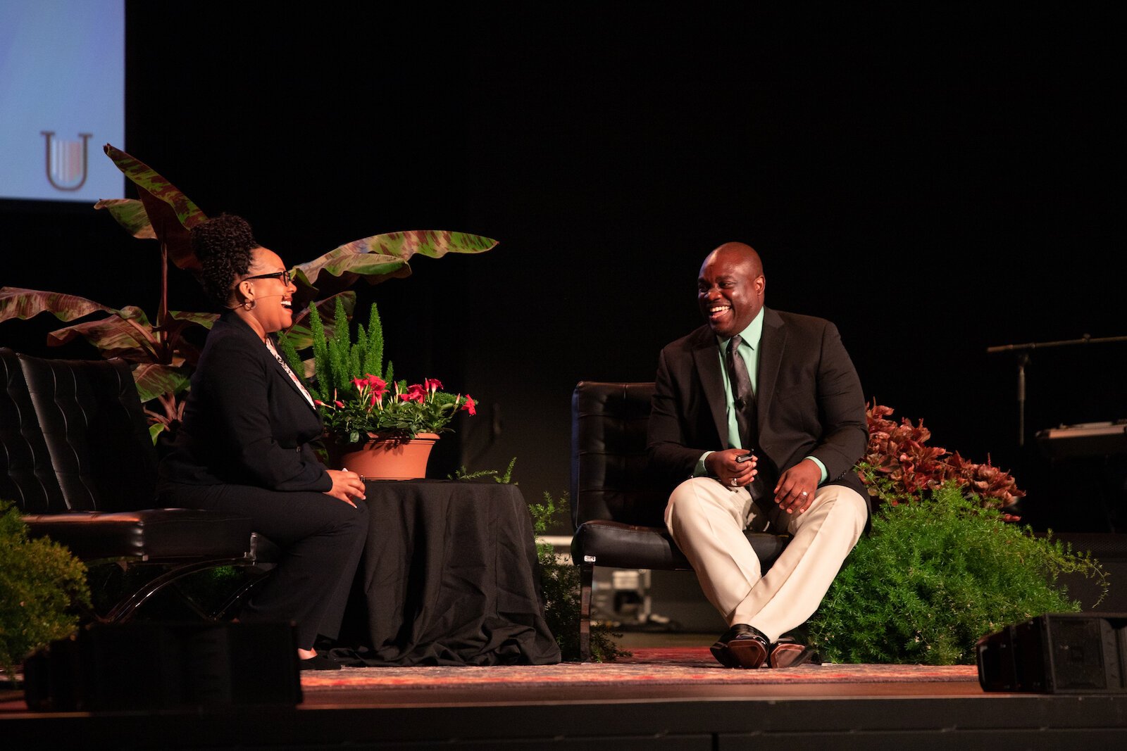 Dr. Losambe, right, leads a United Front keynote session in July at the Clyde Theatre at 1808 Bluffton Rd.