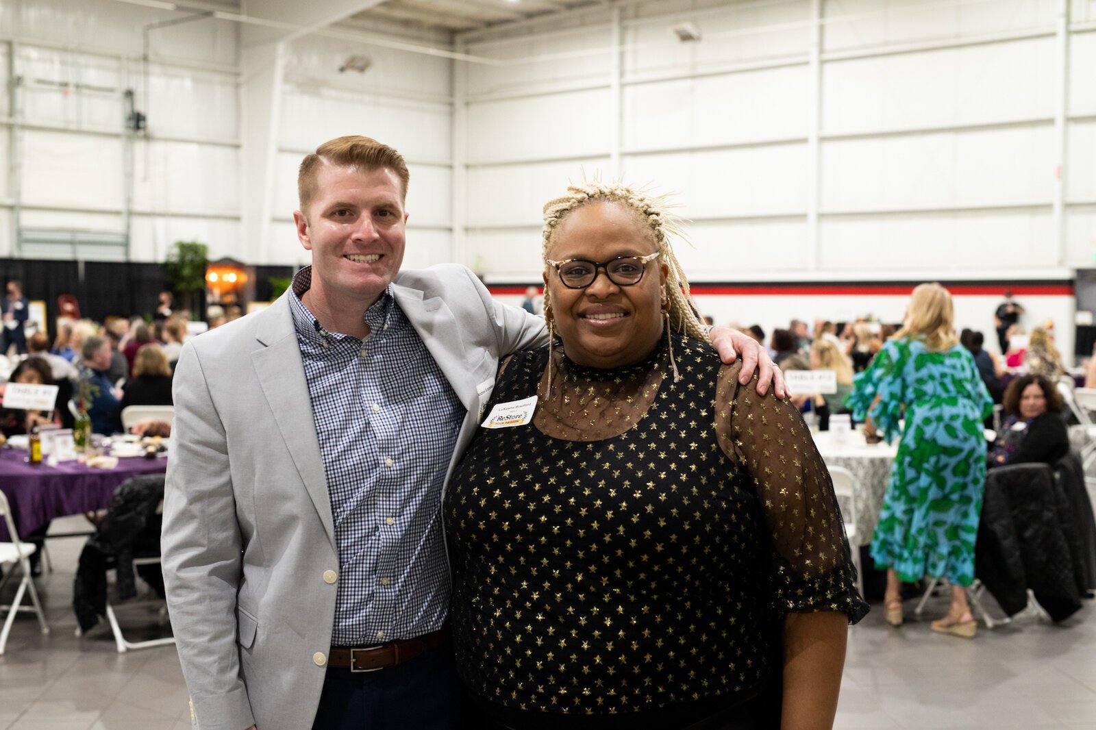 Andrew Gritzmaker, left, of Habitat for Humanity poses with a graduate of Habitat's housing program, LuKesha Bradford.