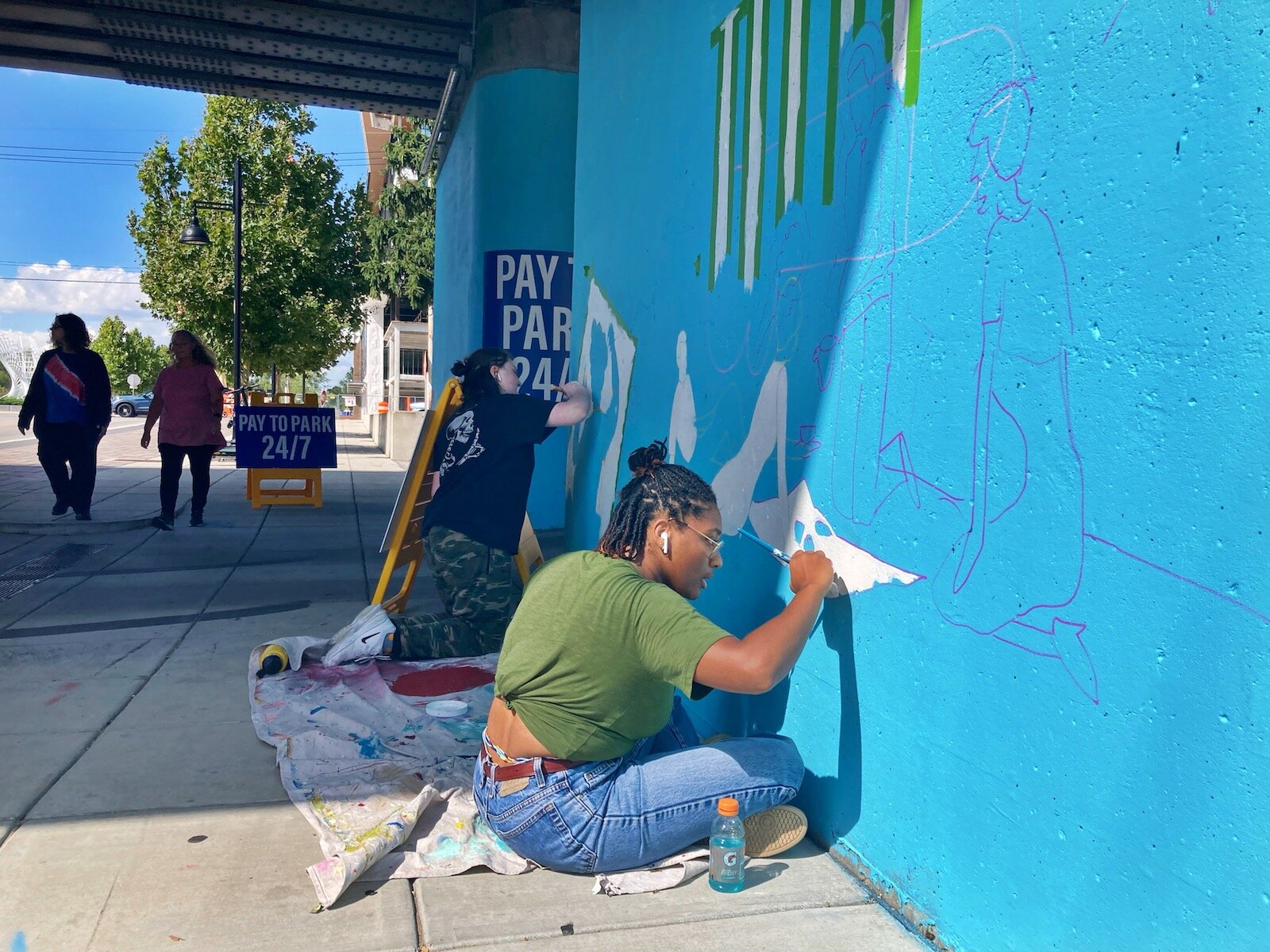 A new Art This Way project, called The Unity Mural, is currently being created steps away from The Landing at the railroad underpass near Harrison and Dock streets.