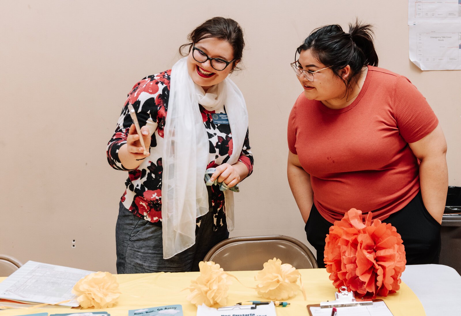 Bernadette Fellows, Community Engagement Planner with the City of Fort Wayne left, talks with Janet Silva, who helped create the event and is Director of Children's Ministry at the church during the Fall Fest event at Harvester Missionary Church.